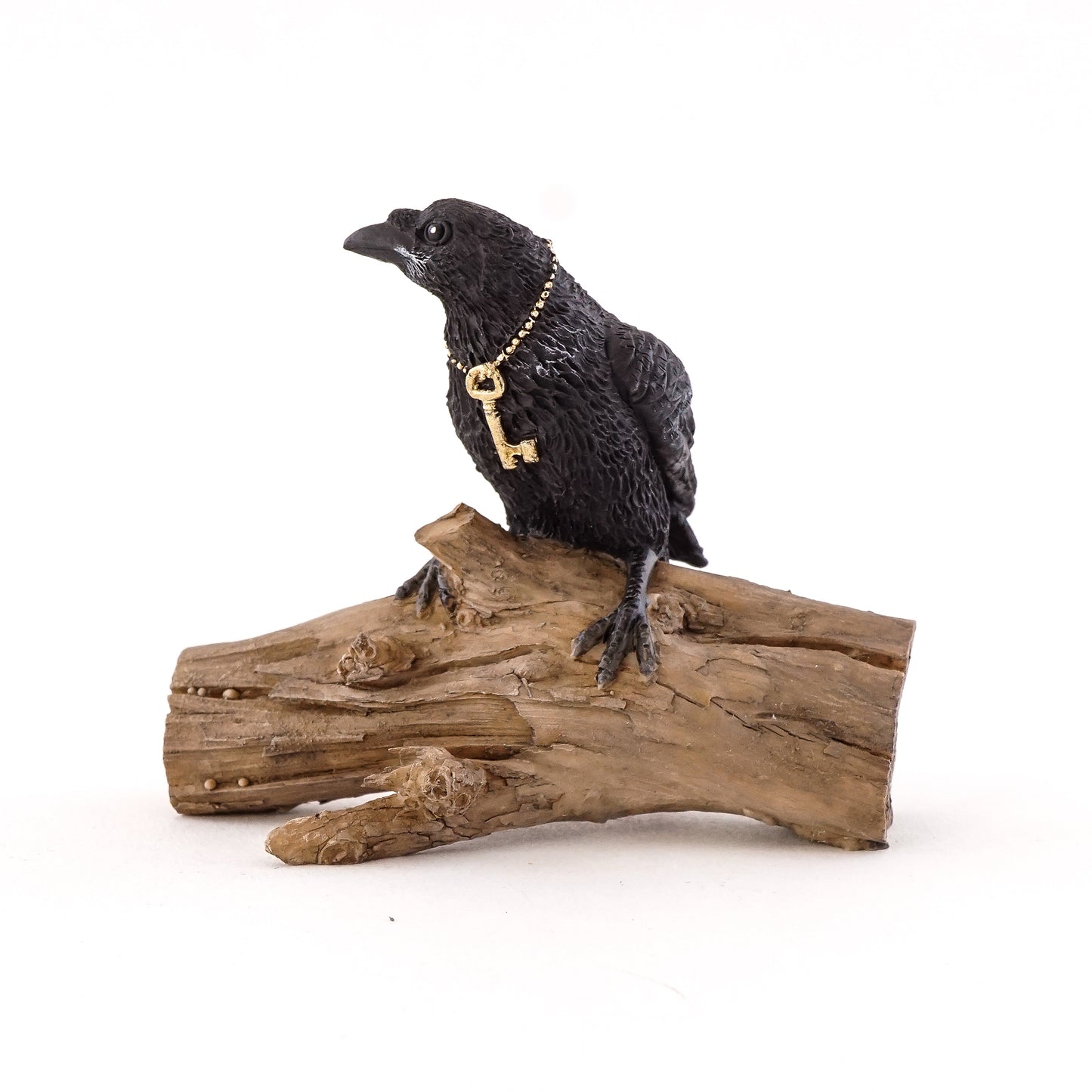 Miniature Raven with Key on Log