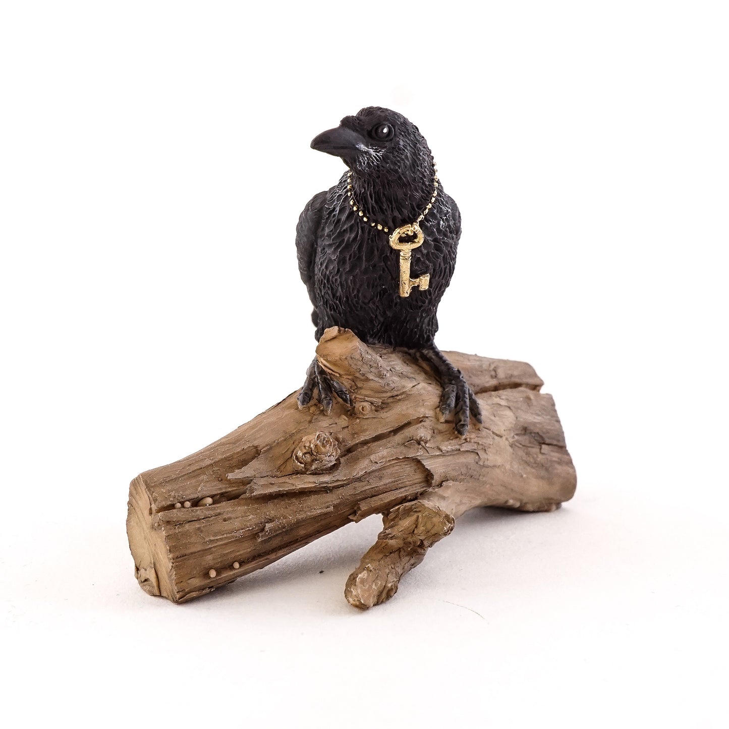 Miniature Raven with Key on Log