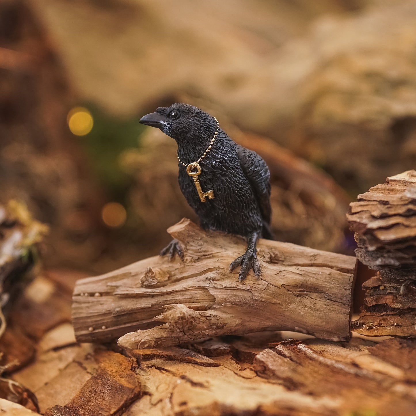 Miniature Raven with Key on Log