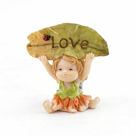 Fairy Baby Holding Love Sign